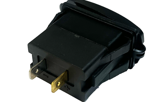 Image of the back of a USB-A dual port charger with 2.4A and 1A independent power per port, featuring an LED indicator._1