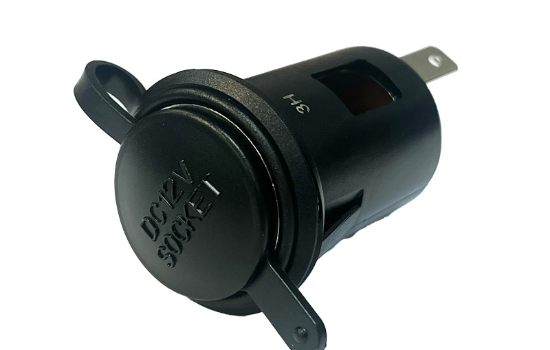 A 12V power outlet designed to mount in a standardized 1-1/8” cut-out, commonly used in vehicles, boats, and RVs for charging devices and powering small appliances.